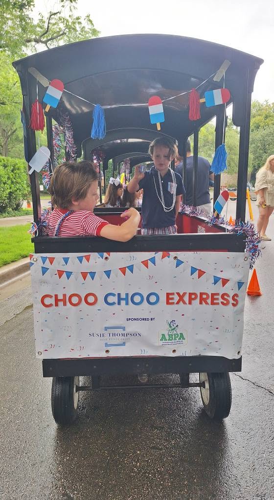 Kids waving from the Choo Choo Express train cars