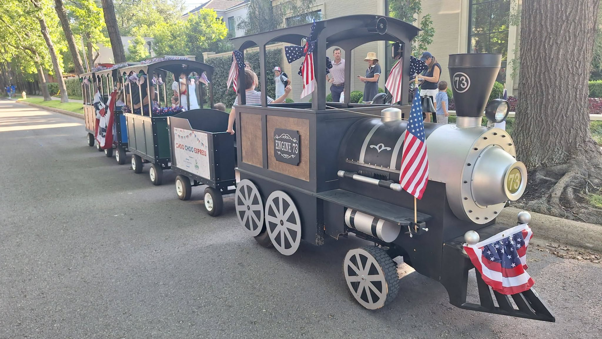 Families riding the Choo Choo Express trackless train